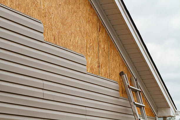 Professional Storm Damage Siding Repair technician working in Point Harbor, NC